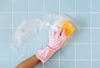 Gloved Hand Washes Tile