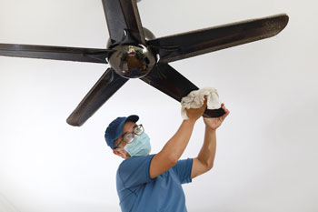Man Cleaning Ceiling Fan