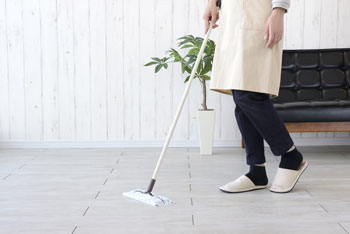Person Dust Mopping Floor
