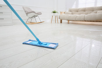 Blue Dust Mop on White Tile Floor
