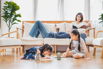 A family of four enjoys time in their living room