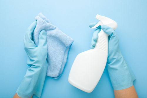 Blue Microfiber Cloth and Bottle of Cleaner