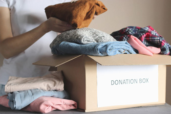 Person Packs up Clothes for Donation