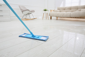 Dust Mop In Bright Living Room with Tile Floor